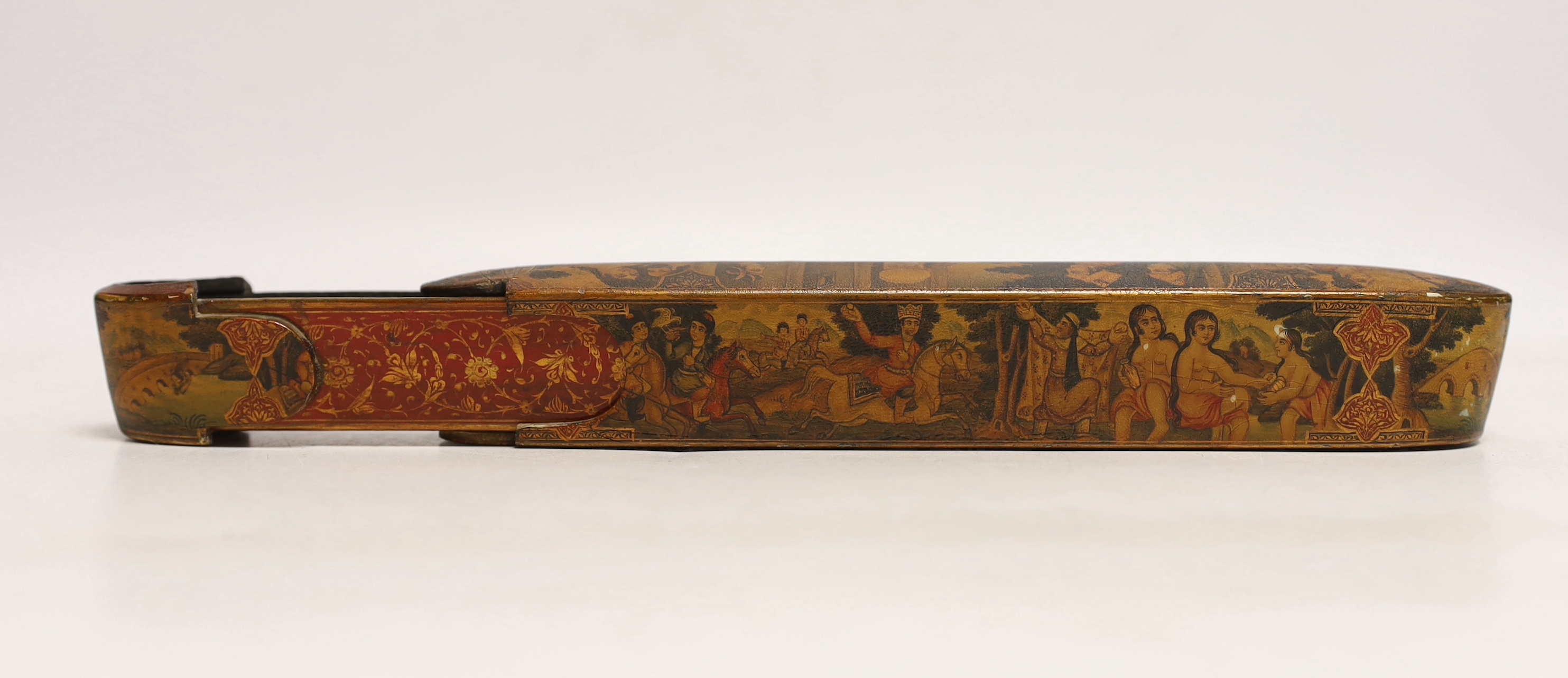 A Persian Qalamdan papier mache scribes or pen box, Qajar dynasty, 22.5cm in length